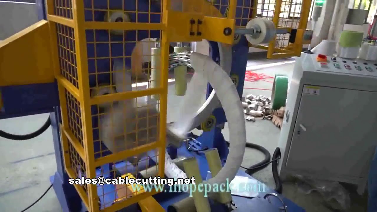 Macchina automatica per imballaggio e avvolgimento di filo spinato e nastro spinato