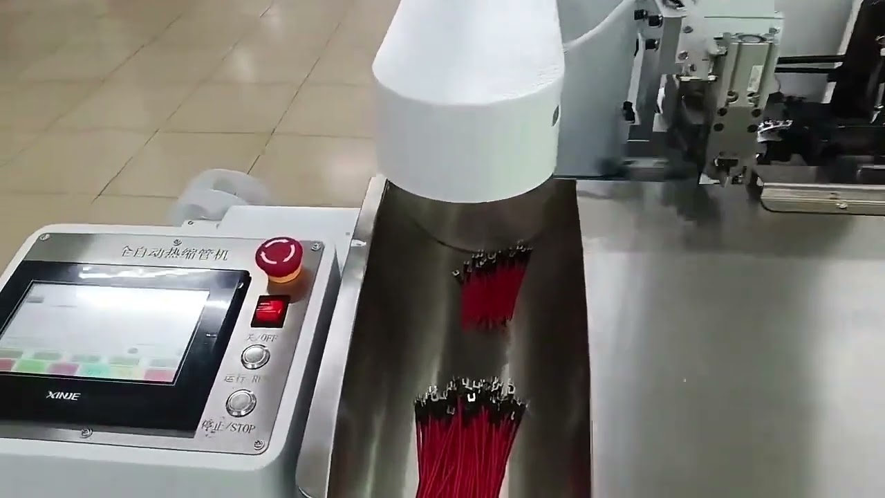 Macchina automatica per inserimento tubi termorestringenti e crimpatura terminali