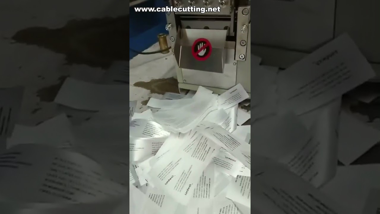 Macchina per taglio e sigillatura di etichette tessute, nastri e cinghie elastiche